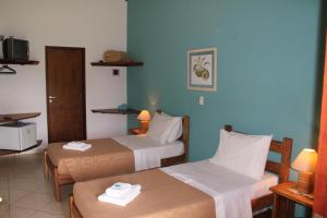 Un pat sau paturi într-o cameră la Hotel Fazenda Jacaúna