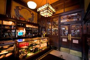 a room with a bar with a lot of alcohol at McMenamins Olympic Club in Centralia