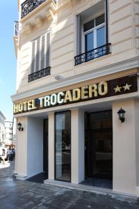 a building with a sign on the front of it at Trocadero in Nice
