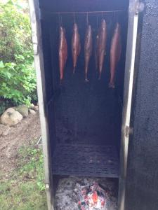 a group of fish in a box over a fire at Oder-Hotel in Schwedt