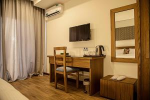 TV a/nebo společenská místnost v ubytování Sierra Palms Resort