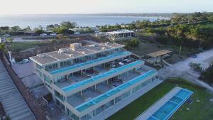 an aerial view of a house with a swimming pool at SYRAH Vistas by depptö in Punta del Este