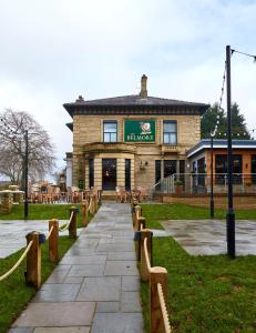 a building with a walkway in front of it at The Belmore in Sale