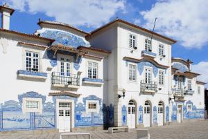 a building with blue and white tiles on it at Aveiro´s Dock Apartments in Aveiro