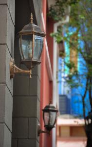a tall brick building with a lamp post on the side of it at Anami Hotel Boutique in La Paz