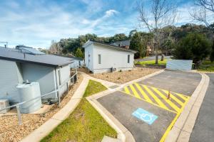 a parking lot in front of a building with a handicapped sign at Albury Yalandra Apartment 1 in Albury