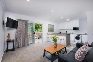 a living room with a couch and a table at Albury Yalandra Apartment 3 in Albury