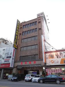 a building with cars parked in front of it at Klai Hotel in Kaohsiung +22 photos