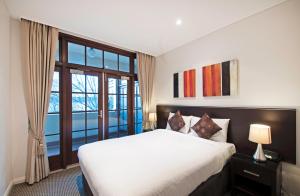 Ein Bett oder Betten in einem Zimmer der Unterkunft Quest Canberra