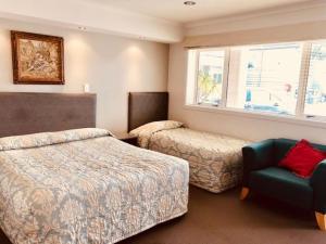 Postel nebo postele na pokoji v ubytování Phoenix Palm Motel