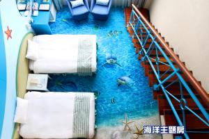 a room with a floor that looks like a pool of water at Uni-Resort Kenting in Eluan