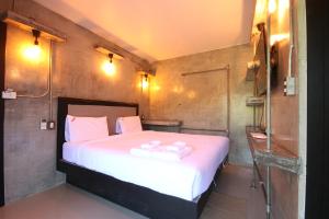Postel nebo postele na pokoji v ubytování AVA Boutique Guesthouse + 37 fotografií