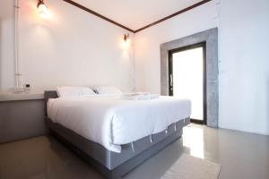 Postel nebo postele na pokoji v ubytování AVA Boutique Guesthouse
