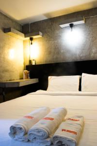 Postel nebo postele na pokoji v ubytování AVA Boutique Guesthouse