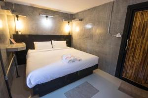 Postel nebo postele na pokoji v ubytování AVA Boutique Guesthouse