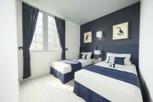 Ένα ή περισσότερα κρεβάτια σε δωμάτιο στο Hotel Beauvilliers