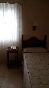 Posteľ alebo postele v izbe v ubytovaní Hotel Cortijo + 29 fotografií