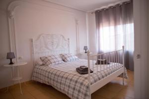 Ένα ή περισσότερα κρεβάτια σε δωμάτιο στο Apartament Casa Neus +14 φωτογραφίες