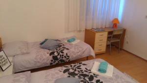 Postel nebo postele na pokoji v ubytování Guest House Adriatic