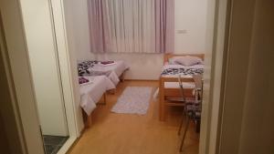 Postel nebo postele na pokoji v ubytování Guest House Adriatic