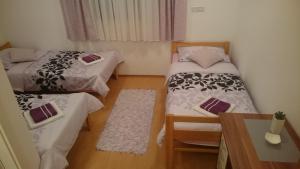 Postel nebo postele na pokoji v ubytování Guest House Adriatic