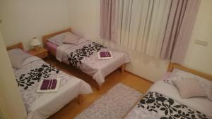 Postel nebo postele na pokoji v ubytování Guest House Adriatic