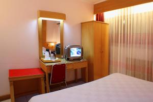 TV a/nebo společenská místnost v ubytování Hotel Hangtuah
