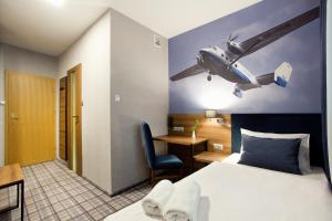 Łóżko lub łóżka w pokoju w obiekcie Hotel Polski