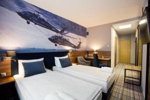 Łóżko lub łóżka w pokoju w obiekcie Hotel Polski