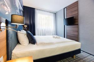 Łóżko lub łóżka w pokoju w obiekcie Hotel Polski