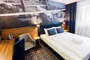 Łóżko lub łóżka w pokoju w obiekcie Hotel Polski