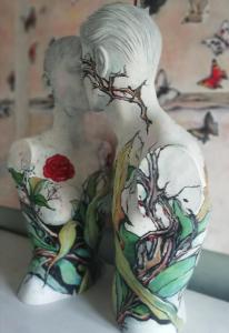 a statue of a man with tattoos on his torso at B&B Art in Bussolengo