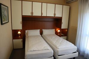 Postel nebo postele na pokoji v ubytování Hotel Bristol