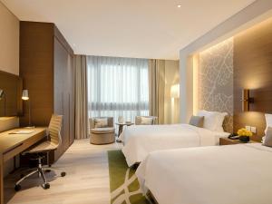 Postel nebo postele na pokoji v ubytování Al Bandar Arjaan by Rotana – Dubai Creek
