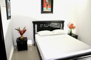 Katil atau katil-katil dalam bilik di Hotel Calle Santodomingo