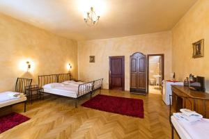 Postel nebo postele na pokoji v ubytování Arcadie Hotel & Apartments