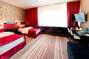 Voodi või voodid majutusasutuse Hotel Symfonia Osjaków toas