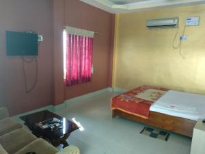 Ένα ή περισσότερα κρεβάτια σε δωμάτιο στο Sunview Resort