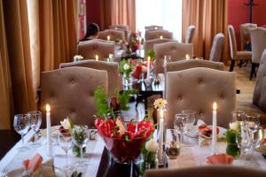 a long table with candles and flowers on it at Country Spa Retreat in Snagov +88 photos