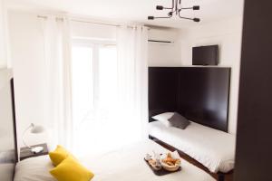 Ένα ή περισσότερα κρεβάτια σε δωμάτιο στο Esperanto