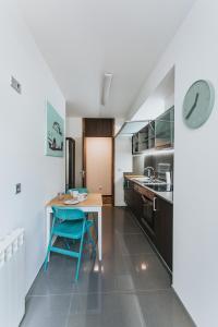 A cozinha ou kitchenette de Magnolia Apartment