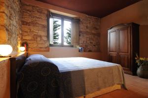 Postel nebo postele na pokoji v ubytování Residence Casa Torretta