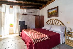 Postel nebo postele na pokoji v ubytování B&B Borgo San Martino