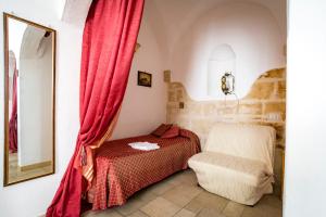Postel nebo postele na pokoji v ubytování B&B Borgo San Martino