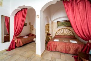Postel nebo postele na pokoji v ubytování B&B Borgo San Martino
