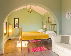 a living room with two beds and a couch at Villa Melolia in Ipsos