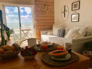 a living room with a table with food on it at Casa Azul in Nazaré