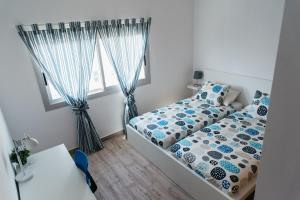 A bed or beds in a room at Mirador De Puerto