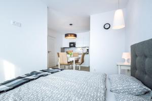 Posteľ alebo postele v izbe v ubytovaní Apartamenty NAVIGATOR-PORT