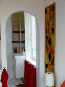 a bathroom with a sink and a mirror at B&B Canal Sight in Amsterdam